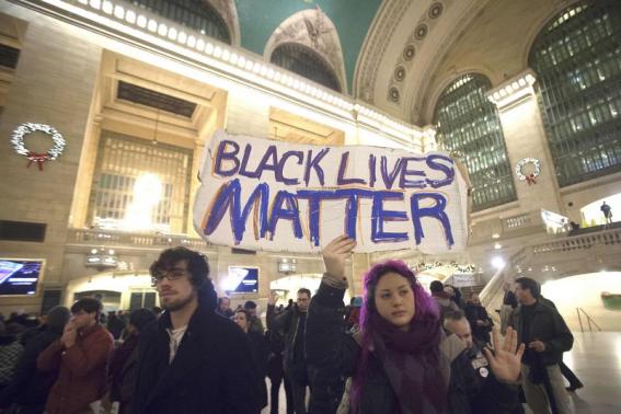 Demonstrators protest to demand justice for the death of Eric Garner, at Grand Central Terminal in the Manhattan borough of New York