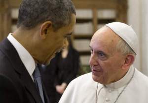 Pope Francis (R) speaks with US President Barack Obama during a private audience on March 27, 2014 at the Vatican. The meeting at the Vatican comes as a welcome rest-stop for Obama during a six-day European tour dominated by the crisis over Crimea, and the US leader will doubtless be hoping some of the pope's overwhelming popularity will rub off on him. AFP PHOTO / SAUL LOEB (Photo credit should read SAUL LOEB/AFP/Getty Images)